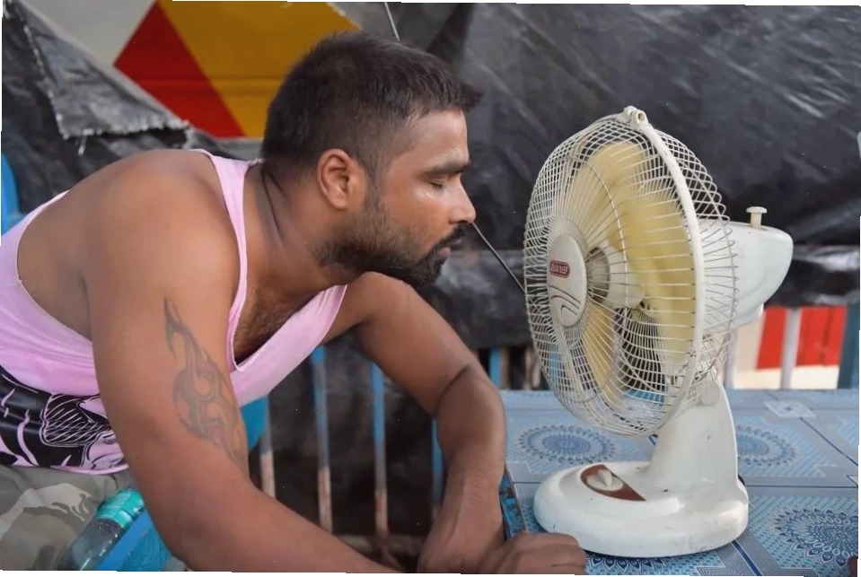 A person seeking relief from feeling hot and sticky India